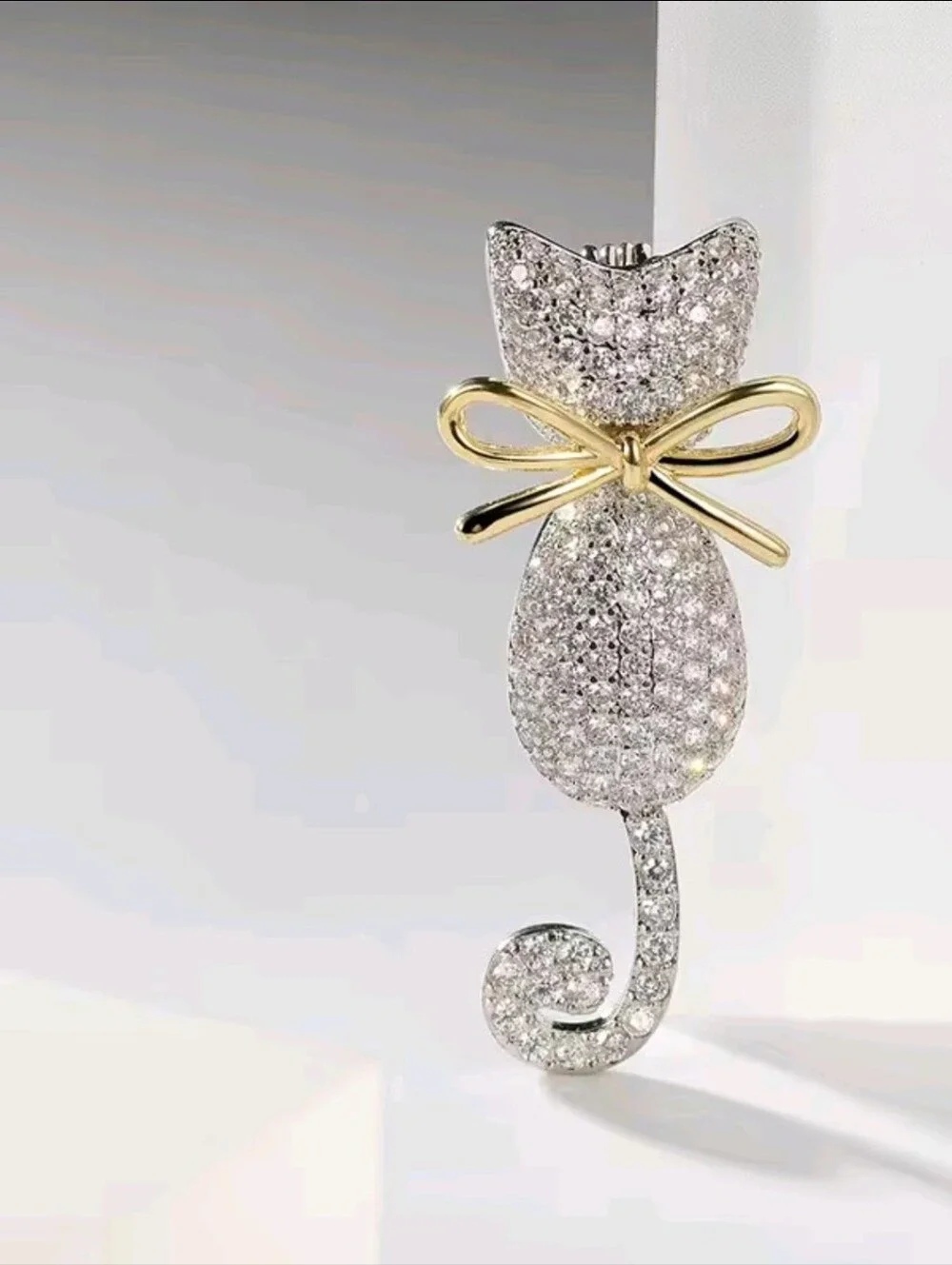 Sparkling Silver Cat Brooch with Gold Bow